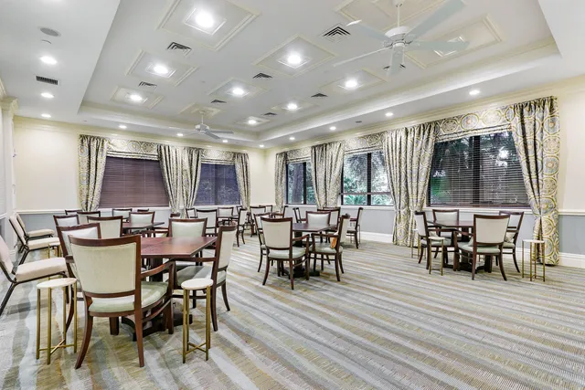 a view of a swimming pool with an outdoor space and seating area