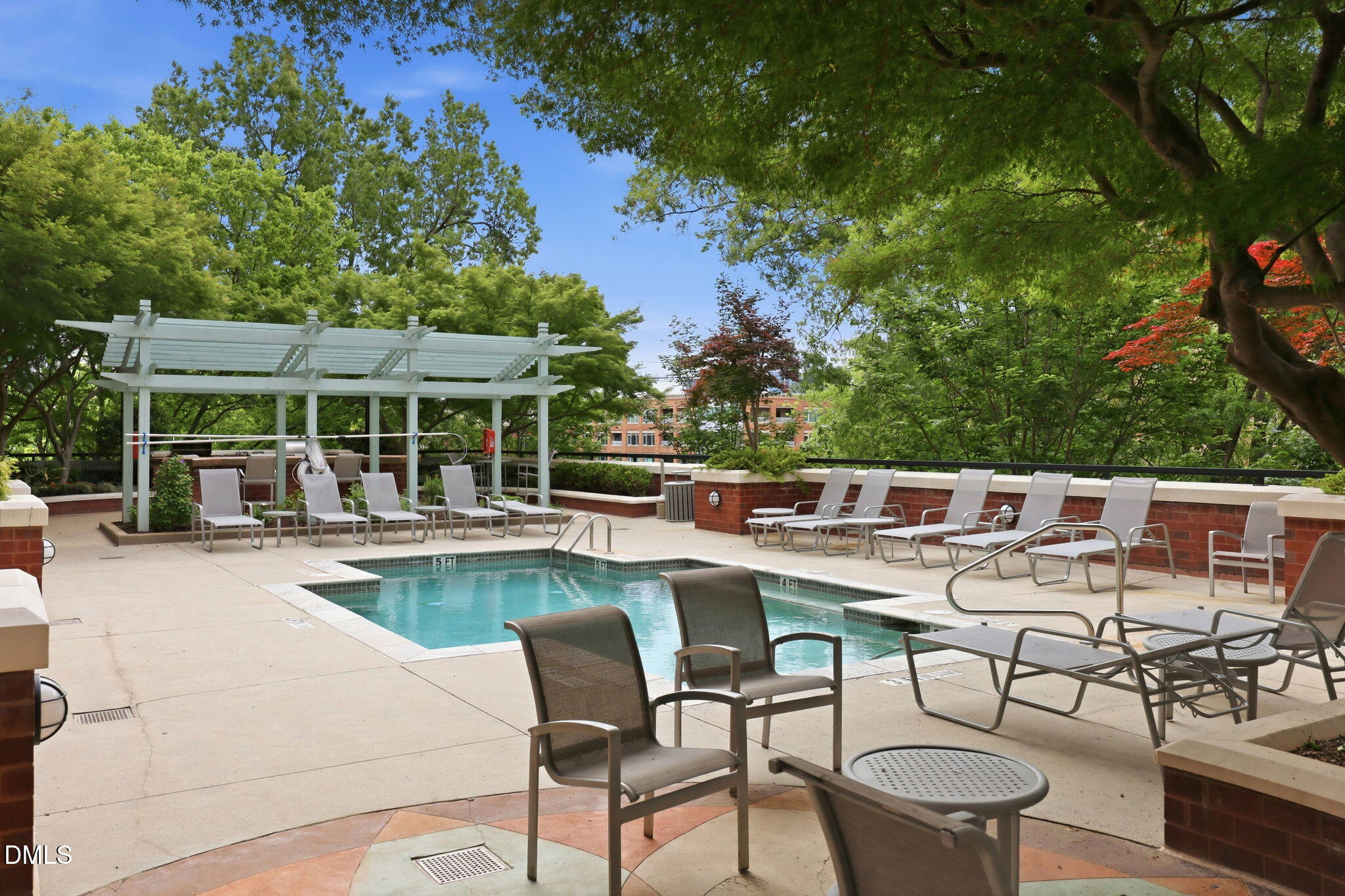 618 North Boylan Avenue, Unit 718 Raleigh, NC 27603 - Photo 23 of 38 a view of a patio with table and chairs potted plants and large tree