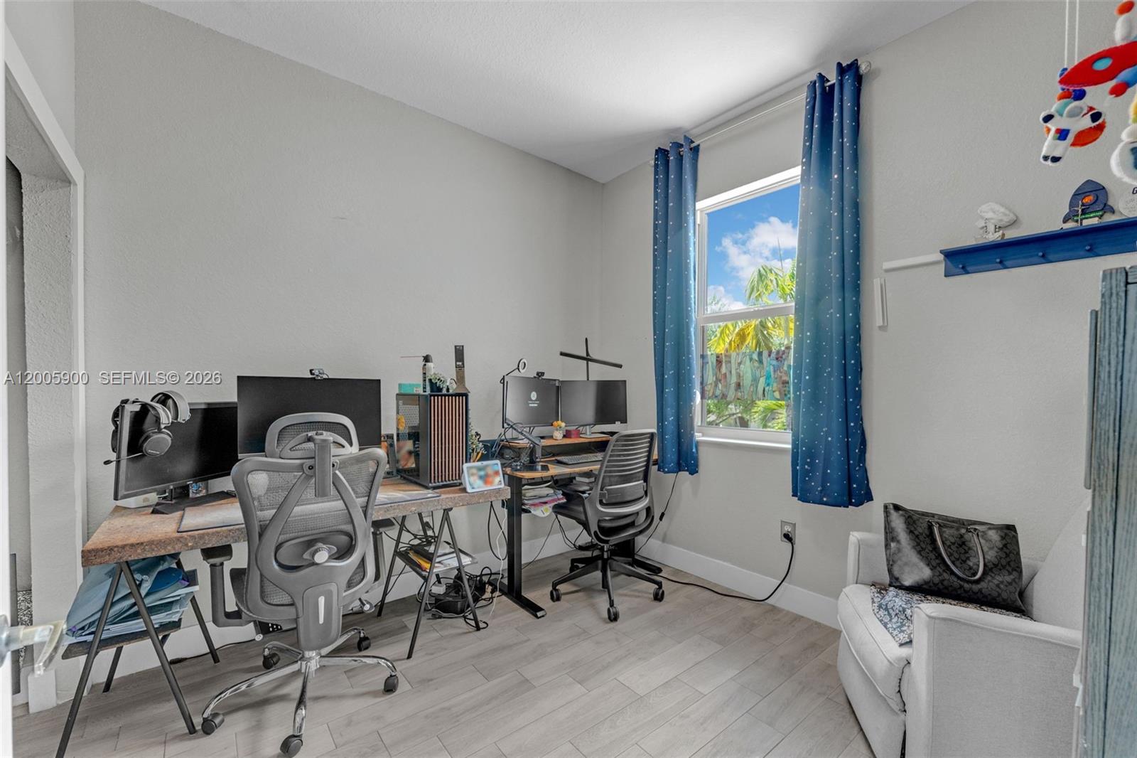 945 Southwest 154th Court Miami, FL 33194 - Photo 21 of 49 a view of a workspace with furniture and toys