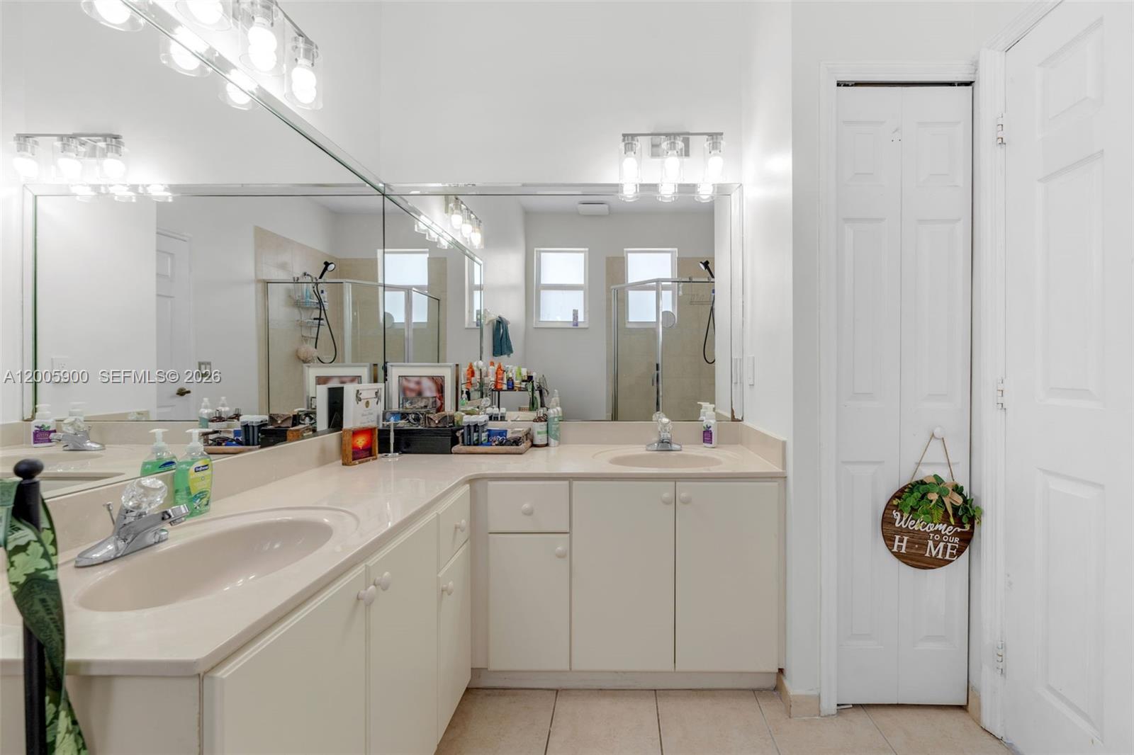 945 Southwest 154th Court Miami, FL 33194 - Photo 24 of 49 a bathroom with a sink and a mirror