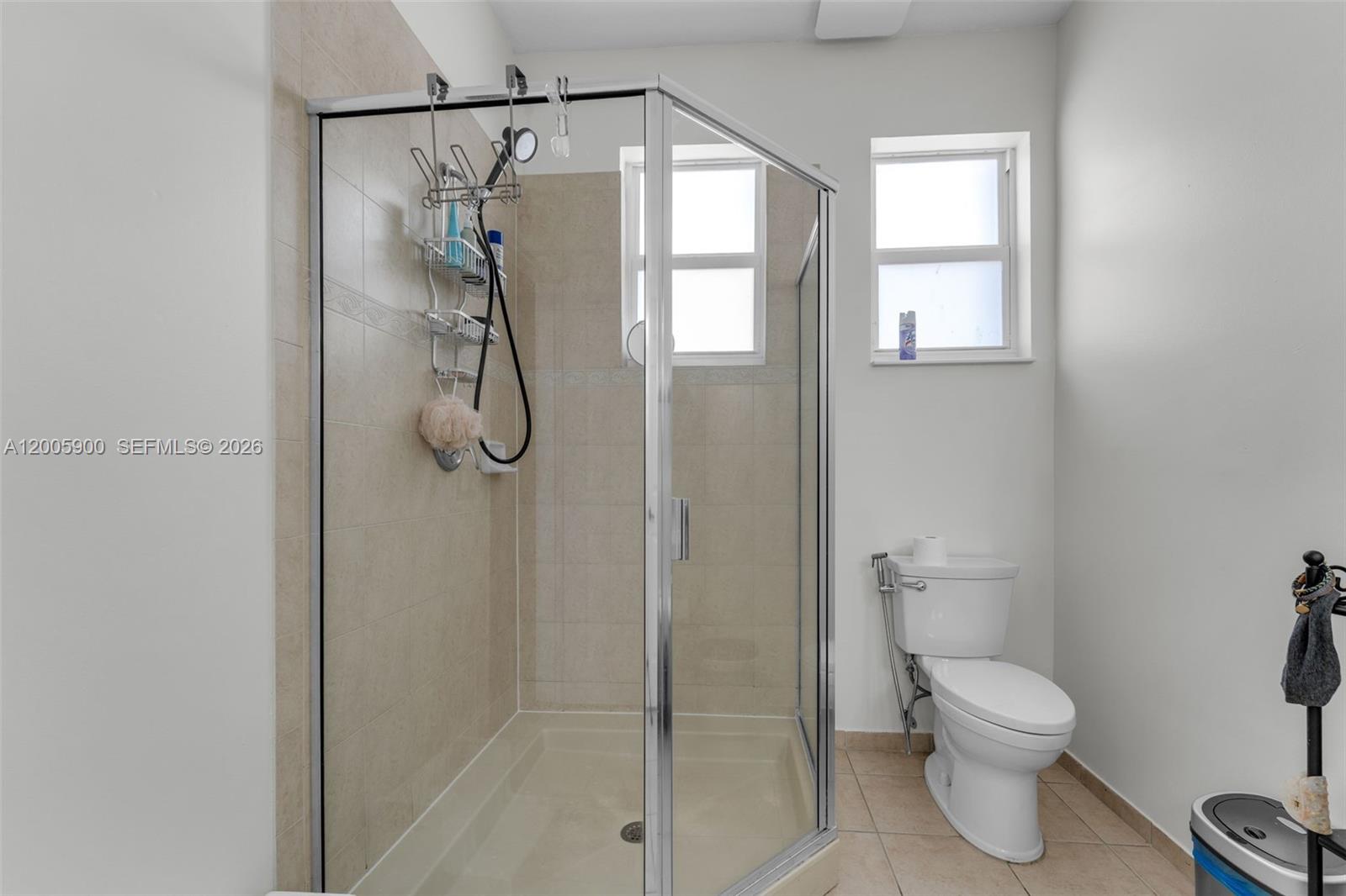 945 Southwest 154th Court Miami, FL 33194 - Photo 25 of 49 a bathroom with a toilet and a shower