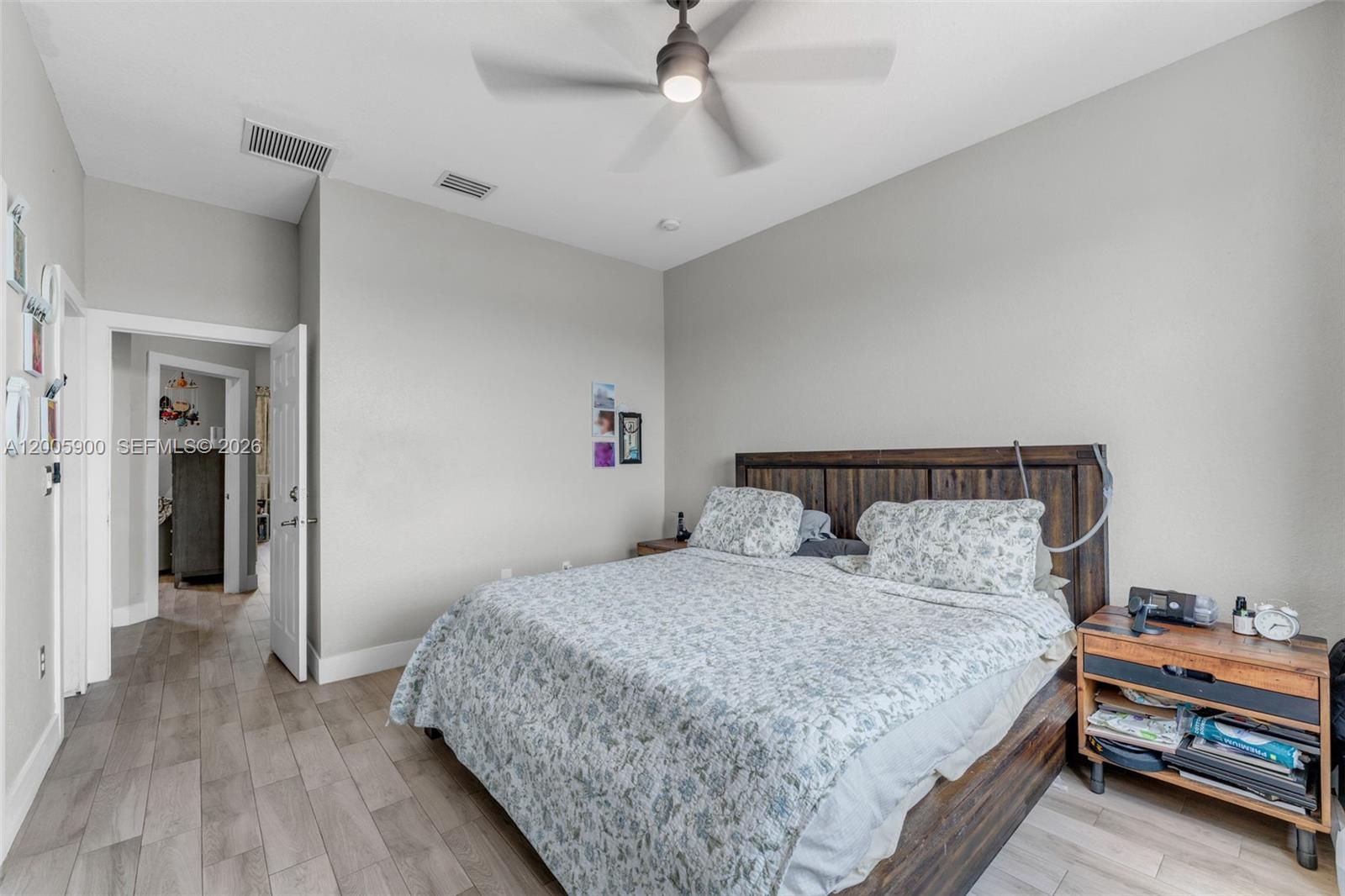 945 Southwest 154th Court Miami, FL 33194 - Photo 28 of 49 a bedroom with a bed and a dresser