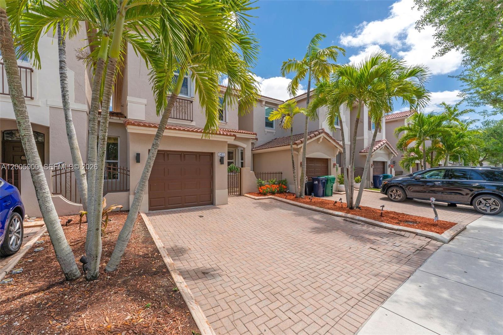 945 Southwest 154th Court Miami, FL 33194 - Photo 3 of 49 a front view of a house with balcony