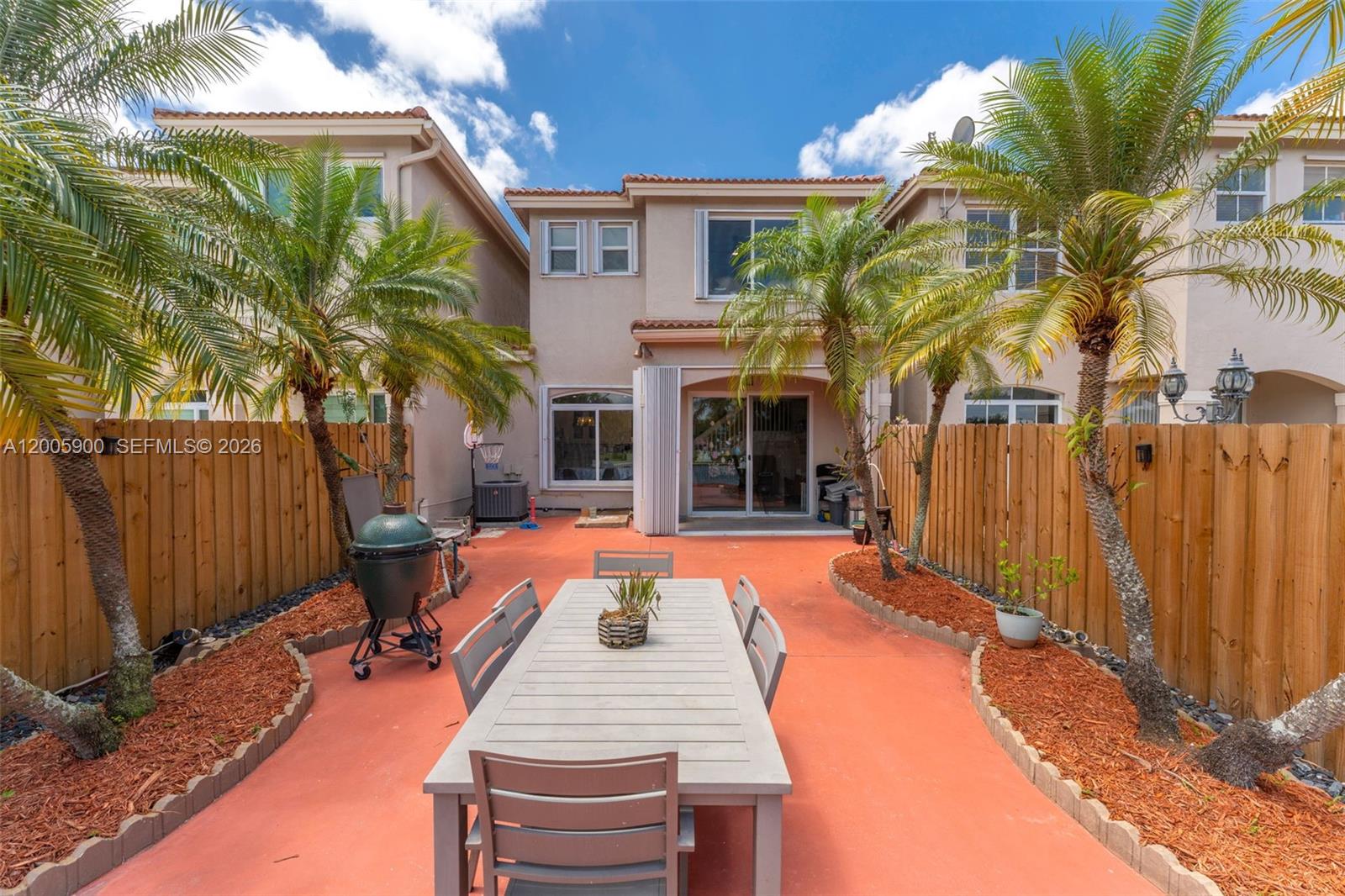 945 Southwest 154th Court Miami, FL 33194 - Photo 32 of 49 a view of a house with backyard porch and sitting area