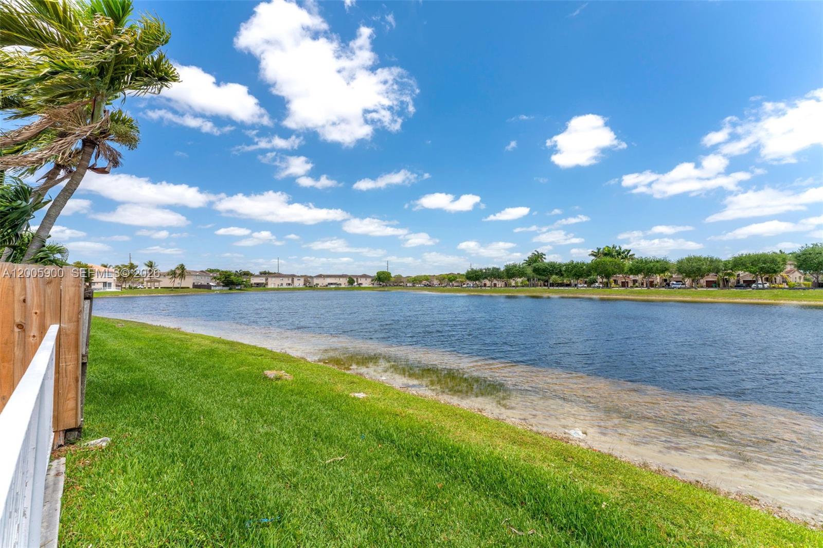 945 Southwest 154th Court Miami, FL 33194 - Photo 33 of 49 a view of a lake with houses in the back