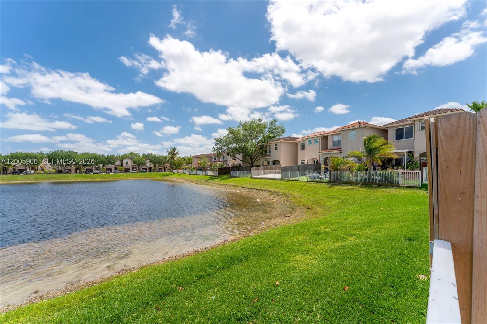 945 Southwest 154th Court Miami, FL 33194 - Photo 34 of 49 a view of a lake with houses