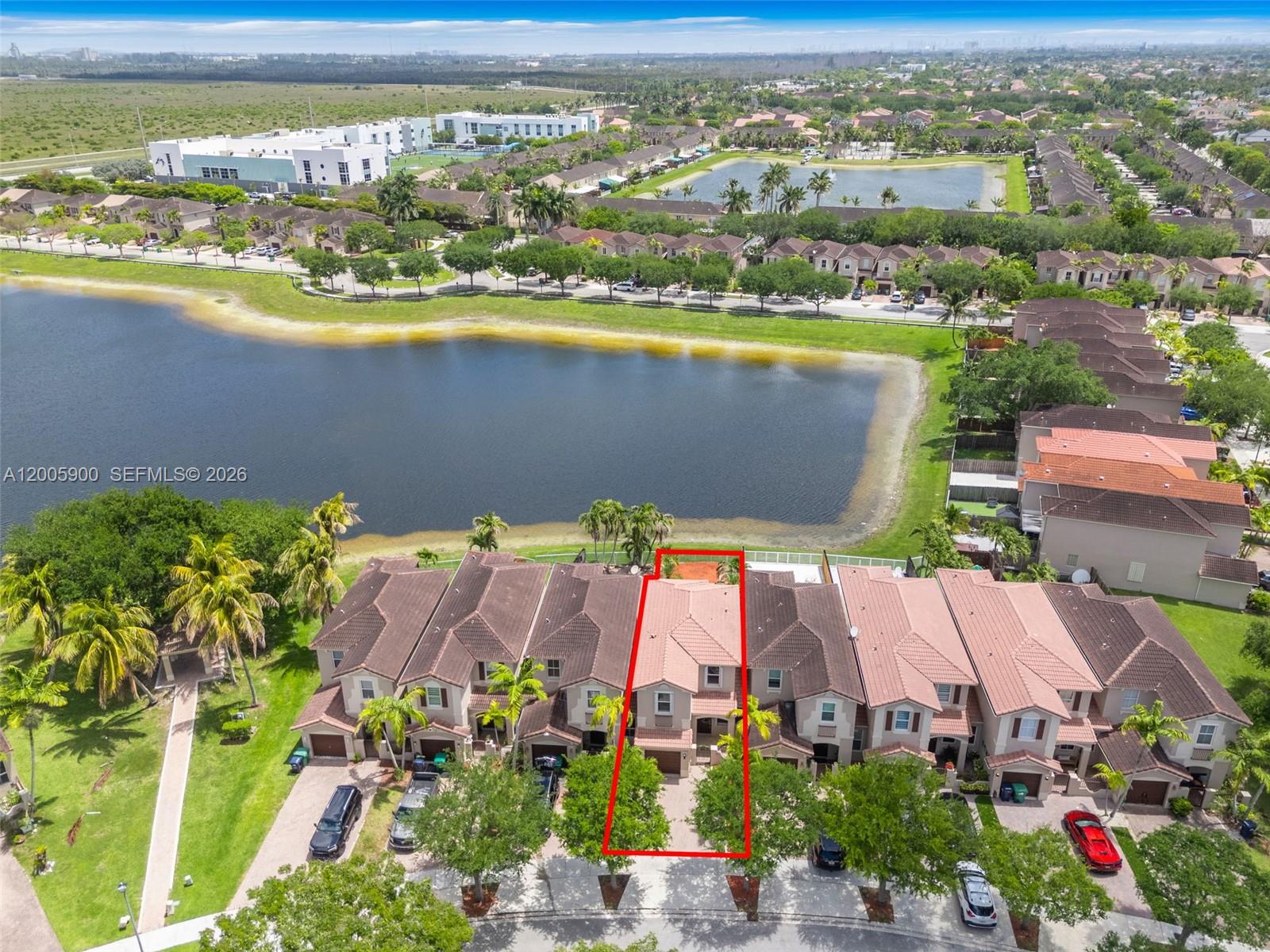 945 Southwest 154th Court Miami, FL 33194 - Photo 35 of 49 an aerial view of residential houses with outdoor space and ocean view