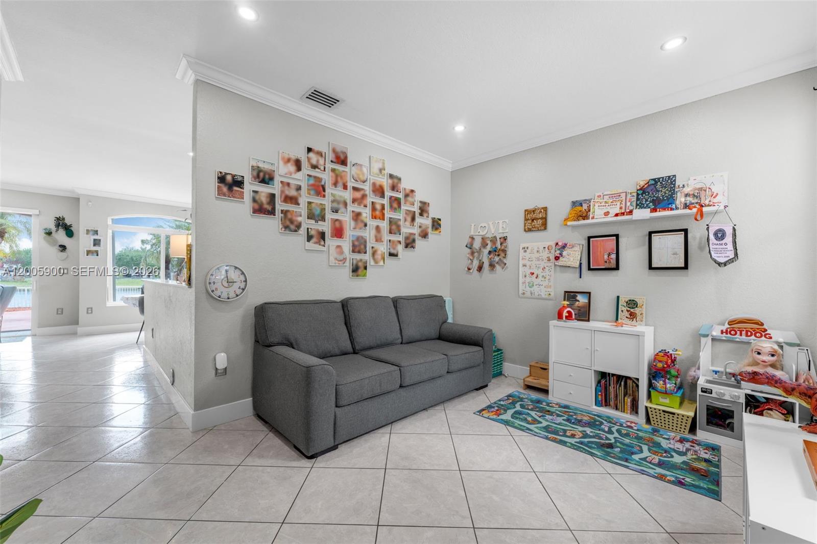 945 Southwest 154th Court Miami, FL 33194 - Photo 6 of 49 a living room with furniture and a table
