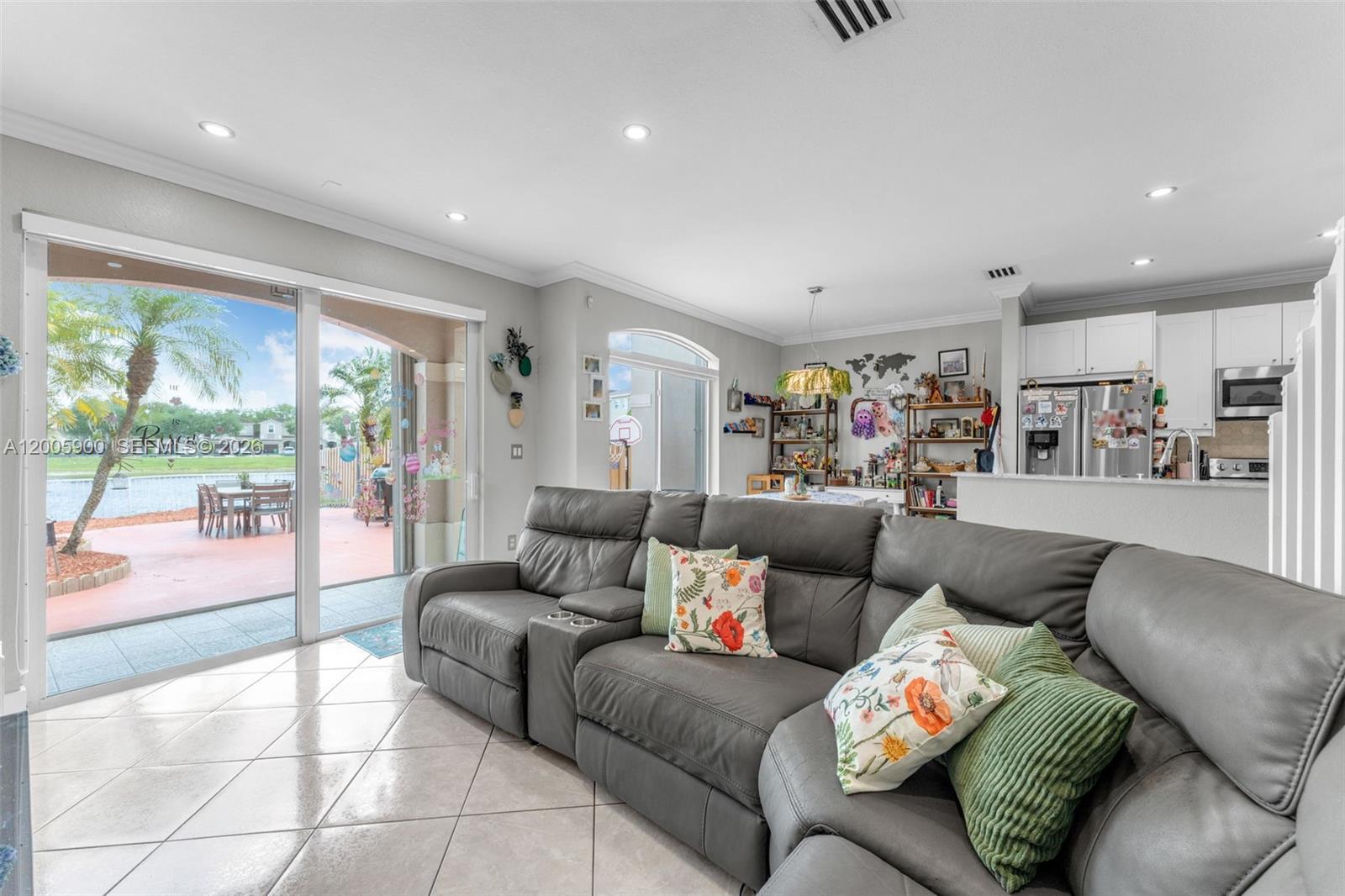 945 Southwest 154th Court Miami, FL 33194 - Photo 10 of 49 a living room with furniture and a large window
