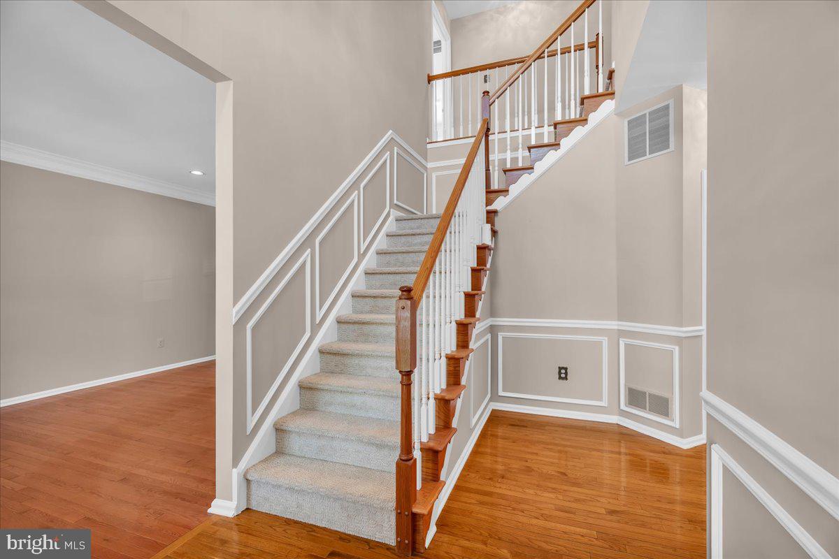 68 Hillside Lane Mount Laurel, NJ 08054 - Photo 4 of 36 a view of staircase with wooden floor and white walls