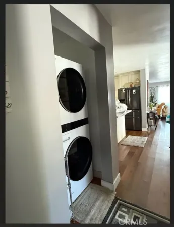 a view of a hallway with washer and dryer