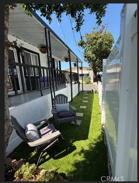 17701 Avalon, Unit 400 Carson, CA 90745 - Photo 8 of 16 a view of a chairs and table in backyard