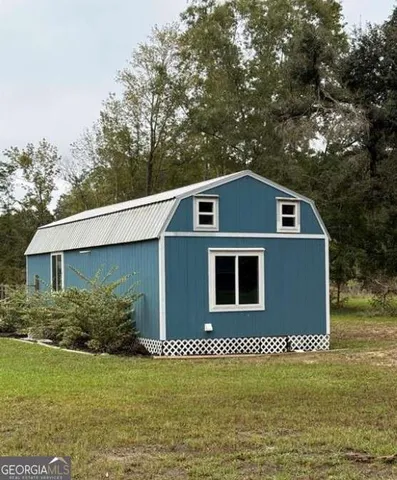 a house that has a tree in front of it