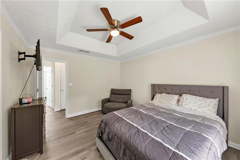 2880 Field Spring Drive Lithonia, GA 30058 - Photo 25 of 31 a bedroom with a bed and a ceiling fan