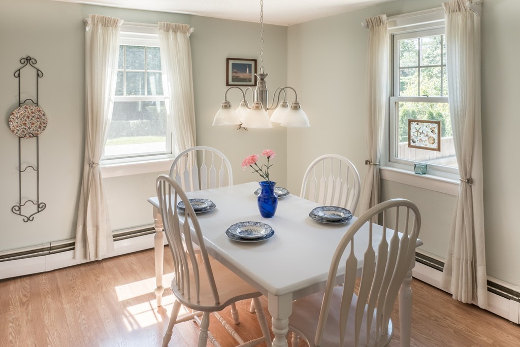 8 May Street Sharon, MA 02067 - Photo 5 of 8 a view of a dining room with furniture window and wooden floor