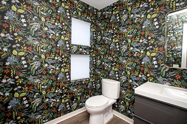 a bathroom with a toilet and a sink