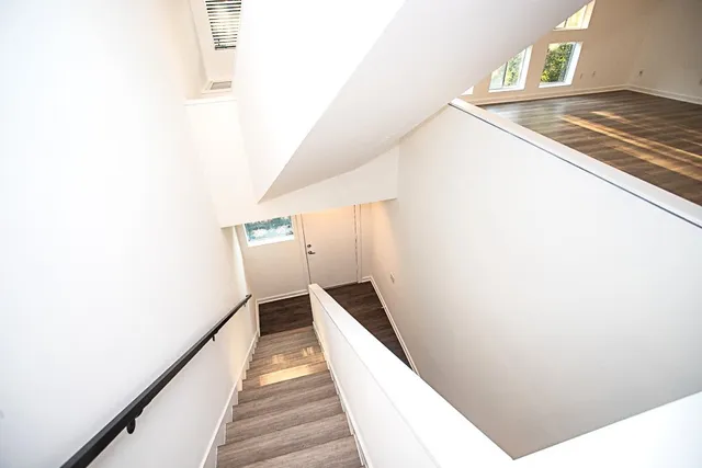 a balcony with a table and chairs