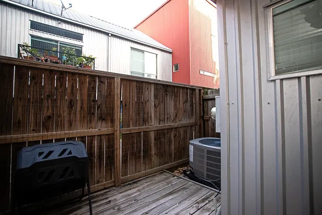 a view of a backyard of a house with wooden floor
