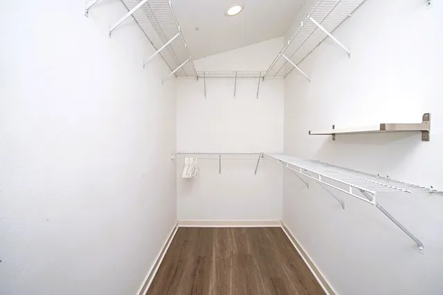 a bathroom with a sink a shower and a mirror