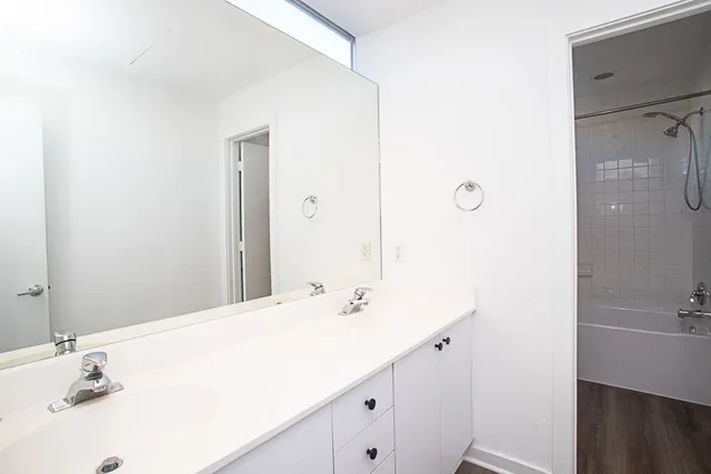 a bathroom with a bathtub and a shower