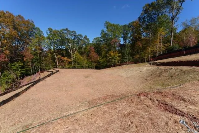 a view of wooden fence and trees