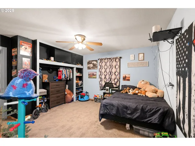 a bedroom with bed and tv