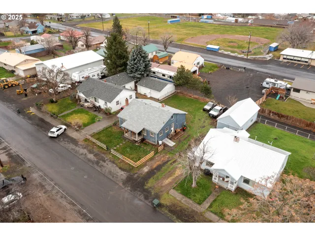 an aerial view of a house with outdoor space