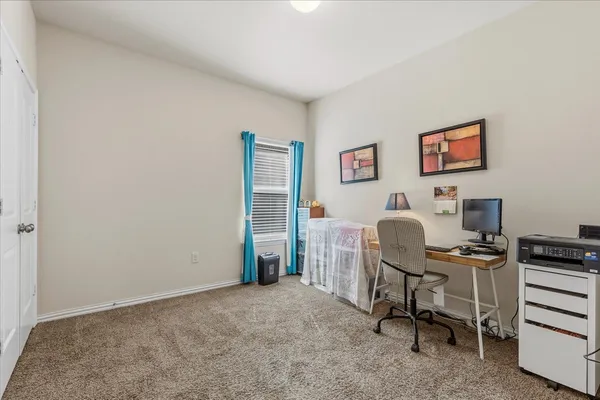 a workspace with furniture and a window