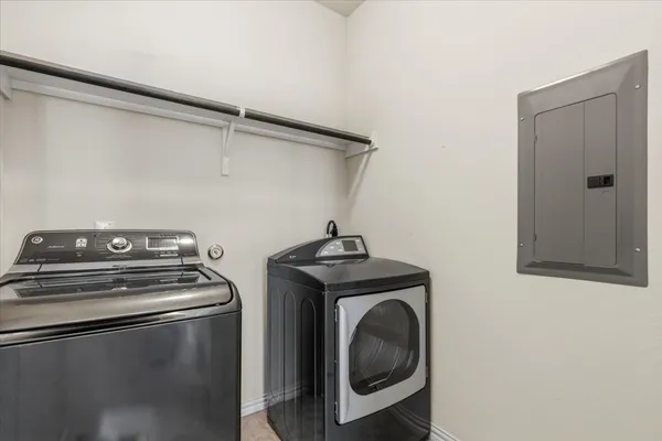 a utility room with dryer and washer