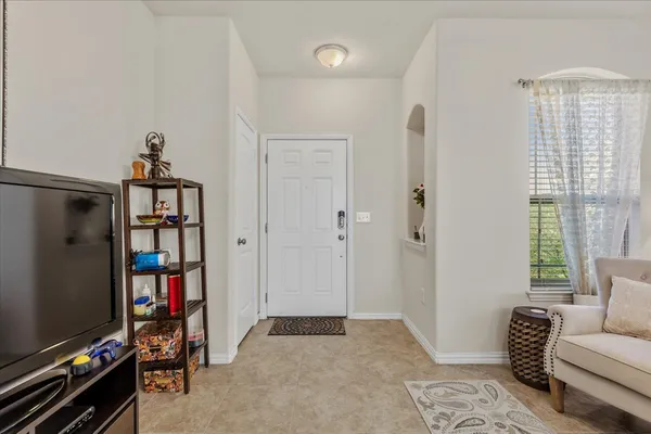 a bedroom with furniture and a window