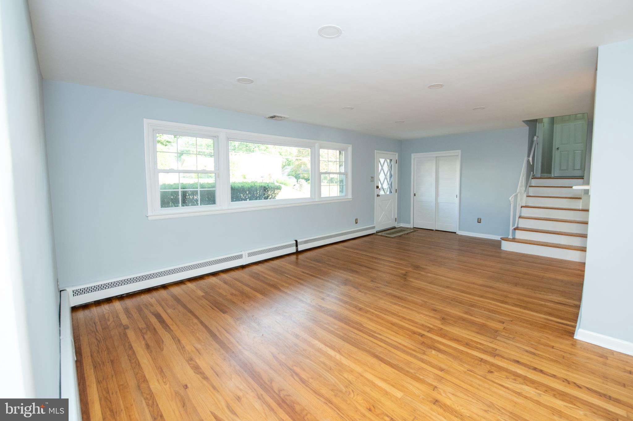 953 Old Ford Road Huntingdon Valley, PA 19006 - Photo 6 of 53 an empty room with wooden floor and windows