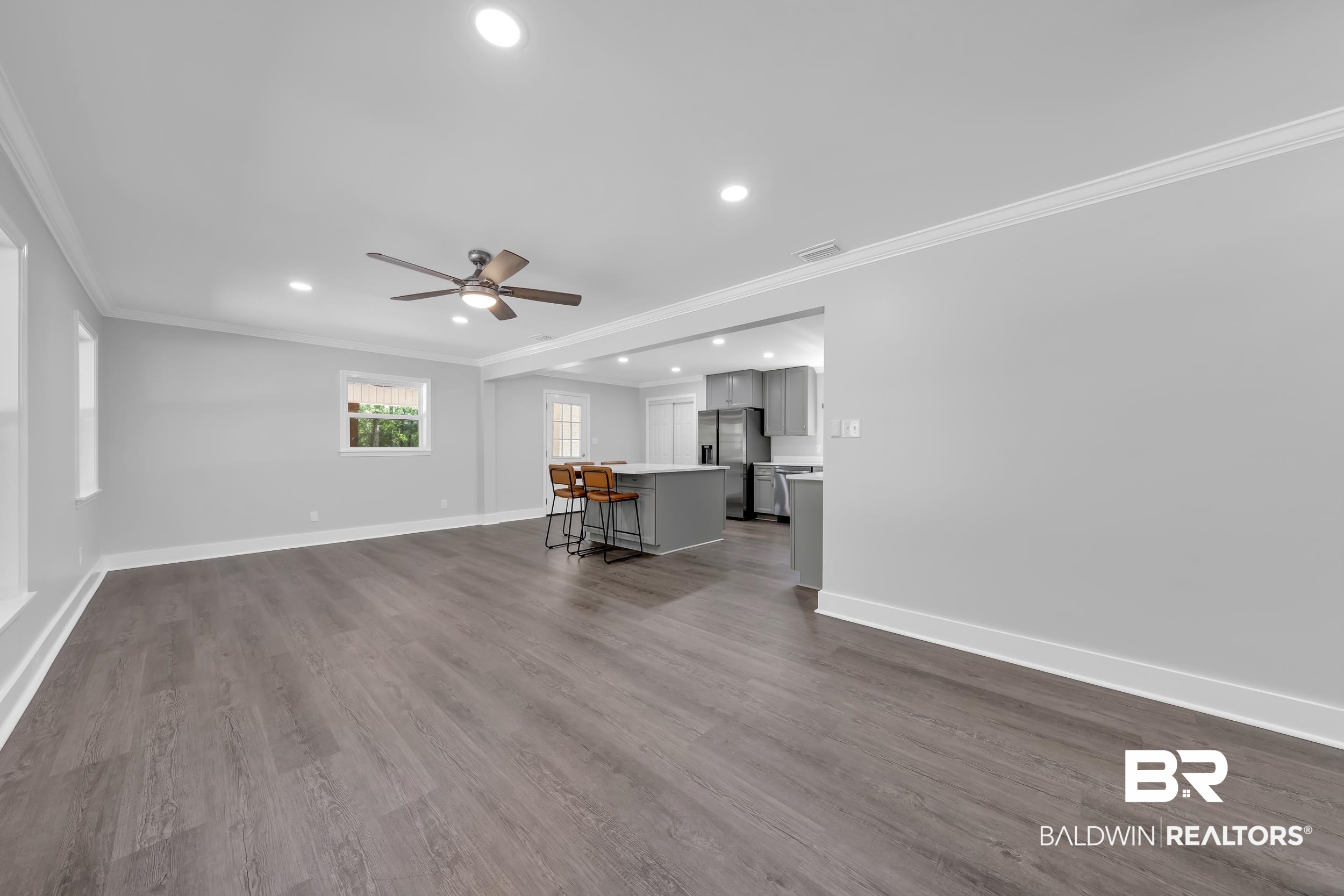 2712 Shelton Beach Rd Extension Mobile, AL 36613 - Photo 6 of 24 Spacious living area featuring wood-finish flooring, recessed lighting, and a ceiling fan