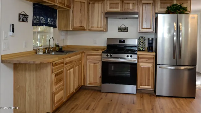 a kitchen with a stove and a refrigerator