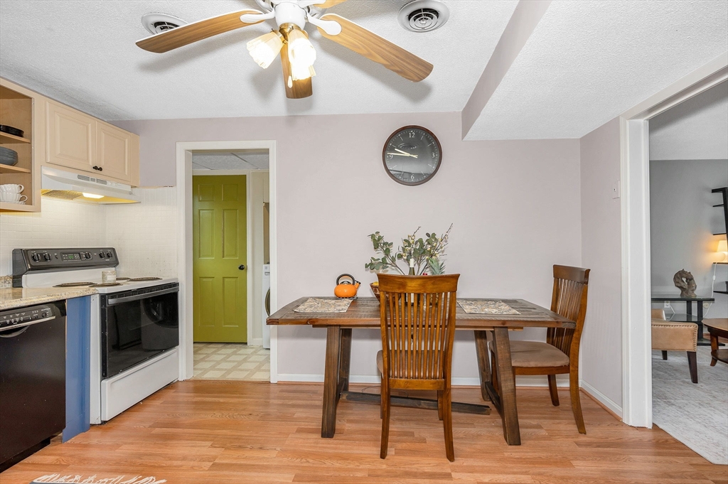 43 Constitution Way, Unit 43 Methuen, MA 01844 - Photo 9 of 25 a dining room with a wooden table and chairs
