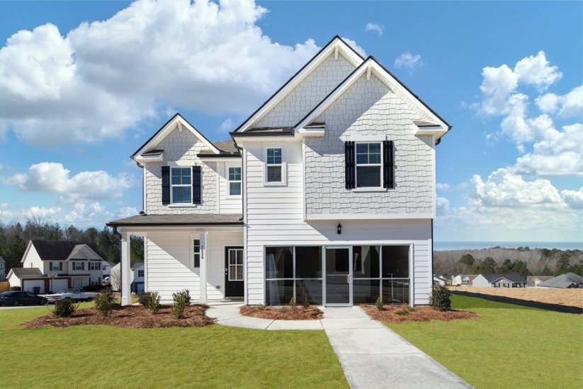 7623 Apostle Road, Unit 138 Fairburn, GA 30213 - Photo 1 of 1 a front view of a house with a yard and potted plants