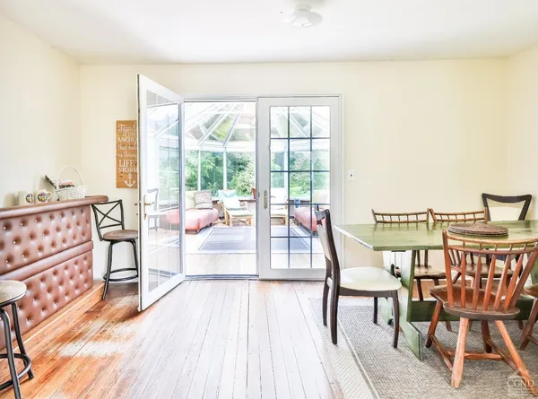 a view of a dining room with furniture window and outside view