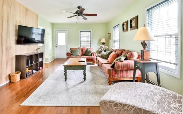 a living room with furniture fireplace and a flat screen tv