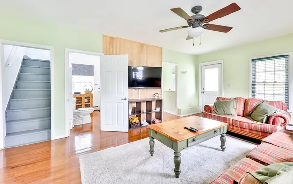 a living room with furniture and a flat screen tv
