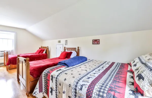 a bed room with a bed and a book shelf