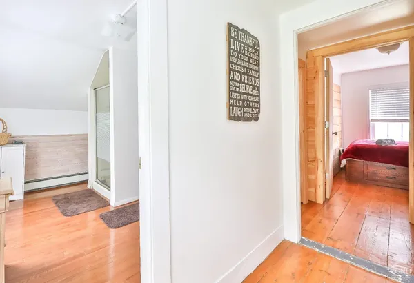 a view of a bedroom from a hallway