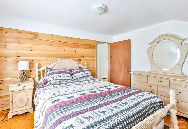 a bed with two bed and a night stand