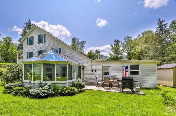 a view of a chairs and table on the wooden floor