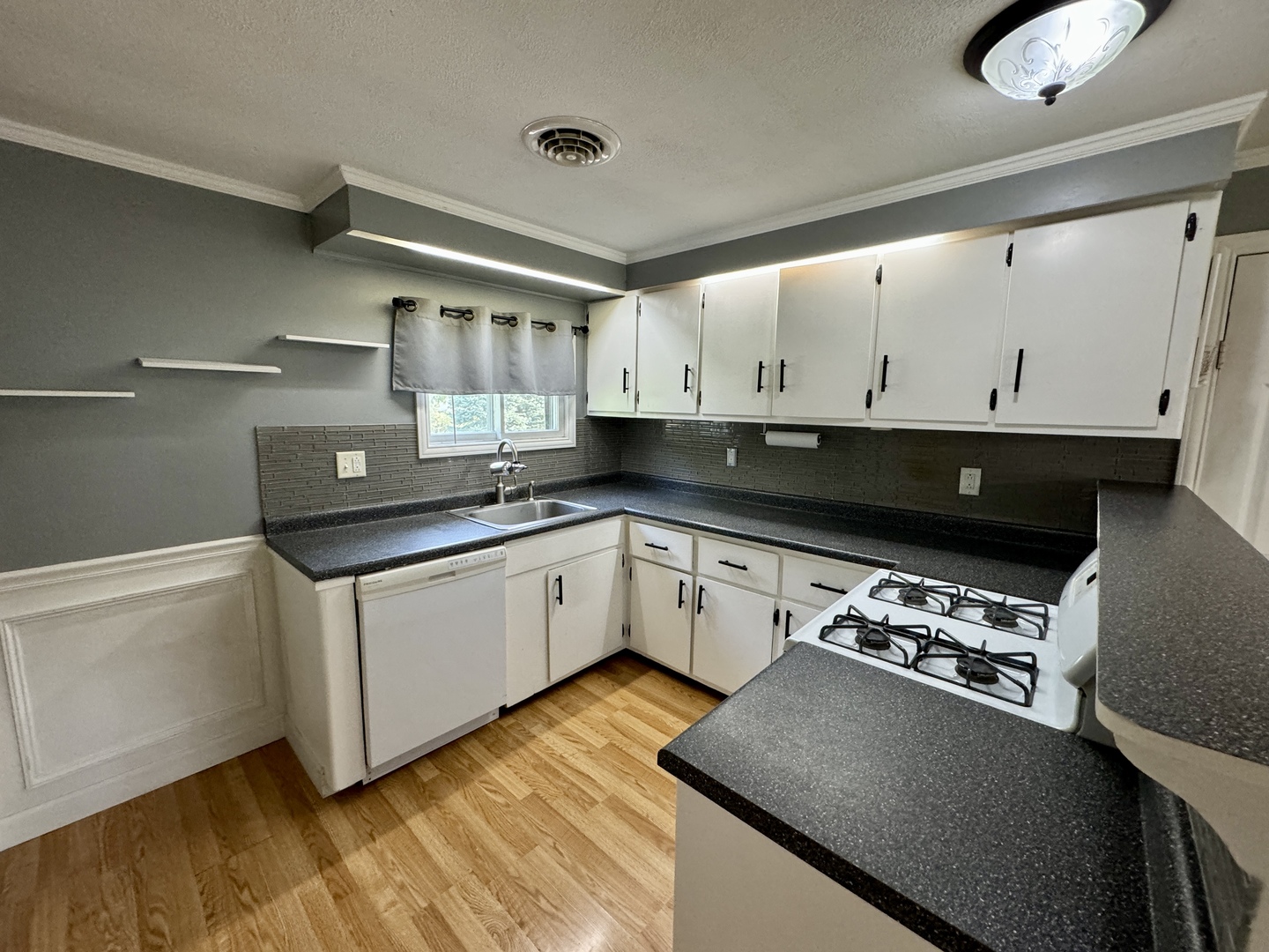 102 Cottage Avenue La Moille, IL 61330 - Photo 11 of 29 a view of a kitchen with stainless steel appliances granite countertop a sink a stove and a refrigerator