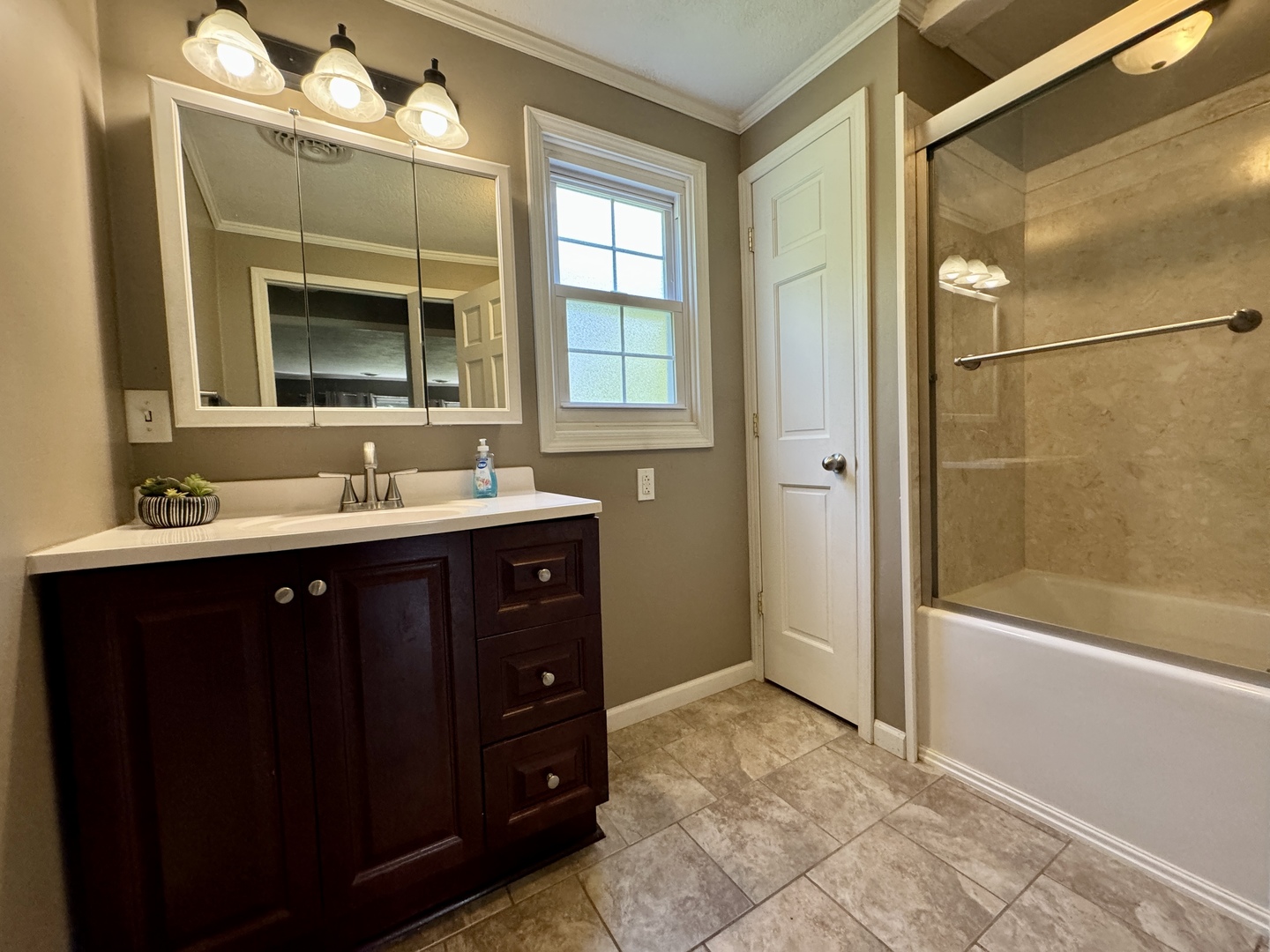 102 Cottage Avenue La Moille, IL 61330 - Photo 13 of 29 a bathroom with a sink vanity tub and shower