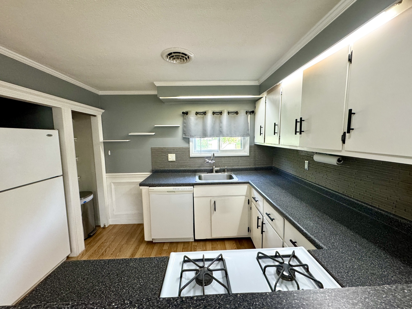 102 Cottage Avenue La Moille, IL 61330 - Photo 14 of 29 a kitchen with a sink a stove cabinets and refrigerator