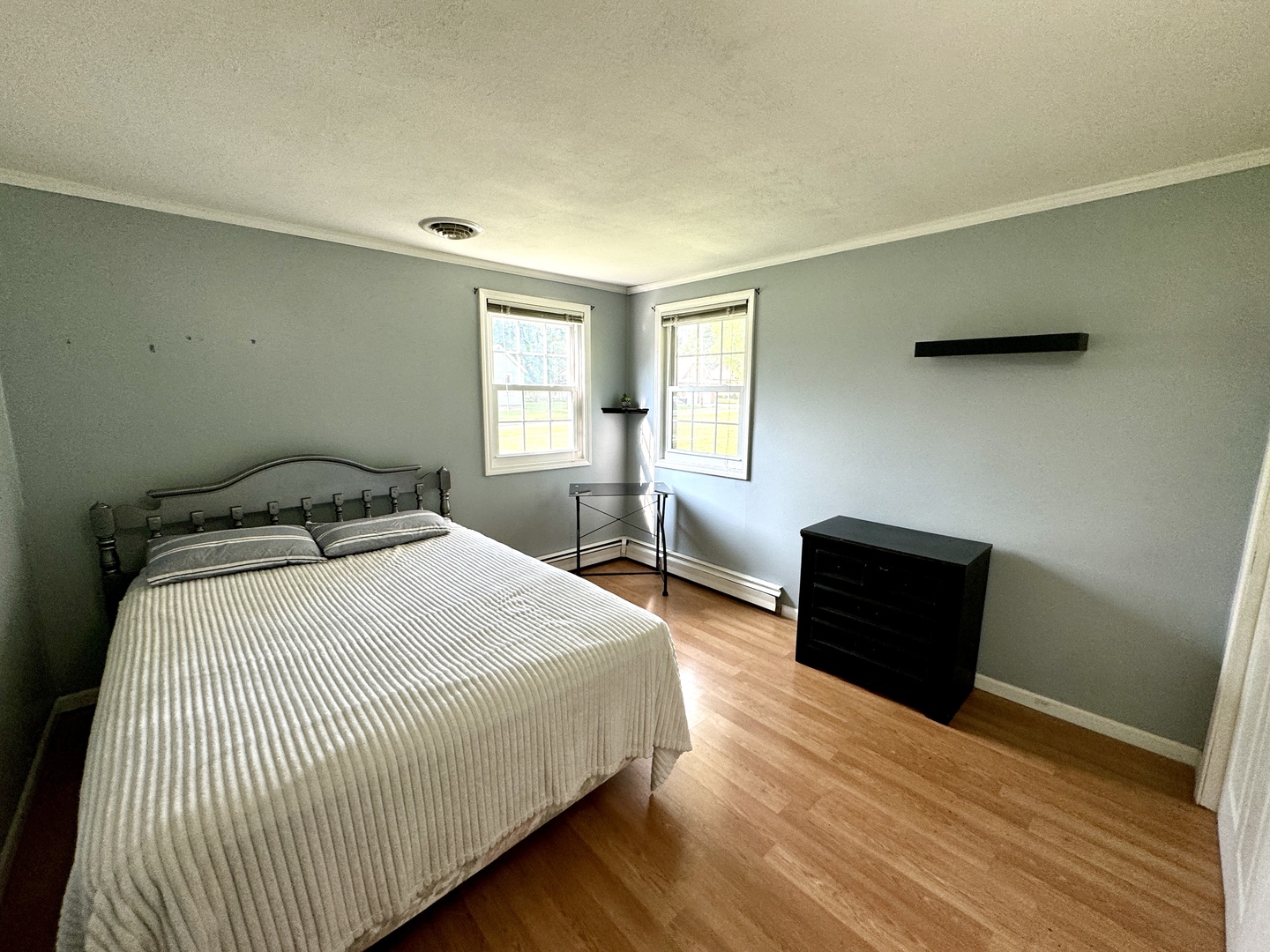102 Cottage Avenue La Moille, IL 61330 - Photo 15 of 29 a bedroom with a bed and wooden floor