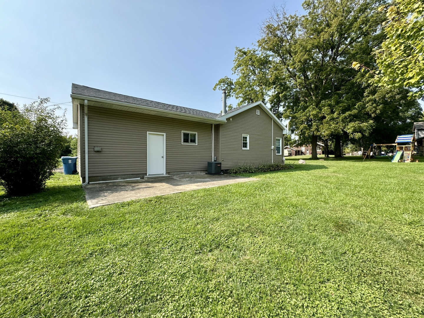102 Cottage Avenue La Moille, IL 61330 - Photo 26 of 29 a front view of a house with a yard and trees