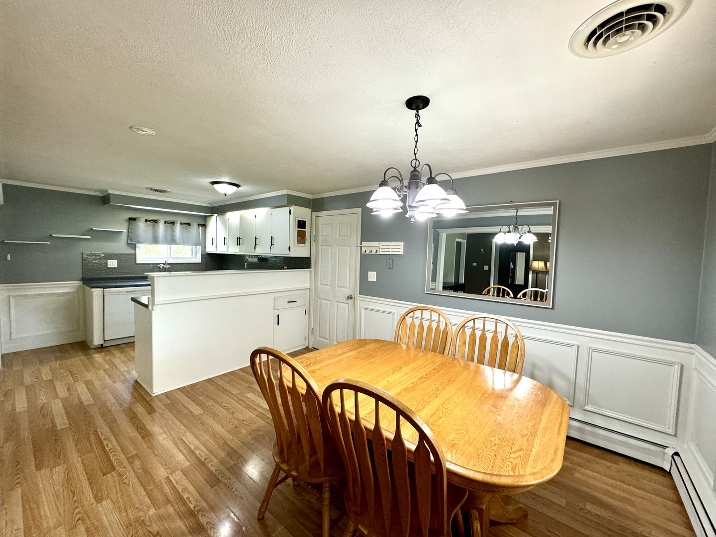 102 Cottage Avenue La Moille, IL 61330 - Photo 9 of 29 a kitchen with stainless steel appliances kitchen island granite countertop a table chairs sink and cabinets