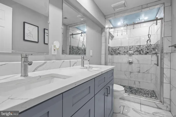 a kitchen with appliances a sink and cabinets