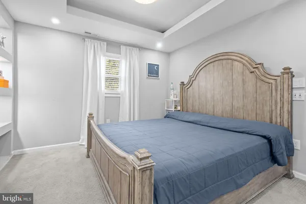 a kitchen with stainless steel appliances kitchen island granite countertop a stove a sink and a microwave